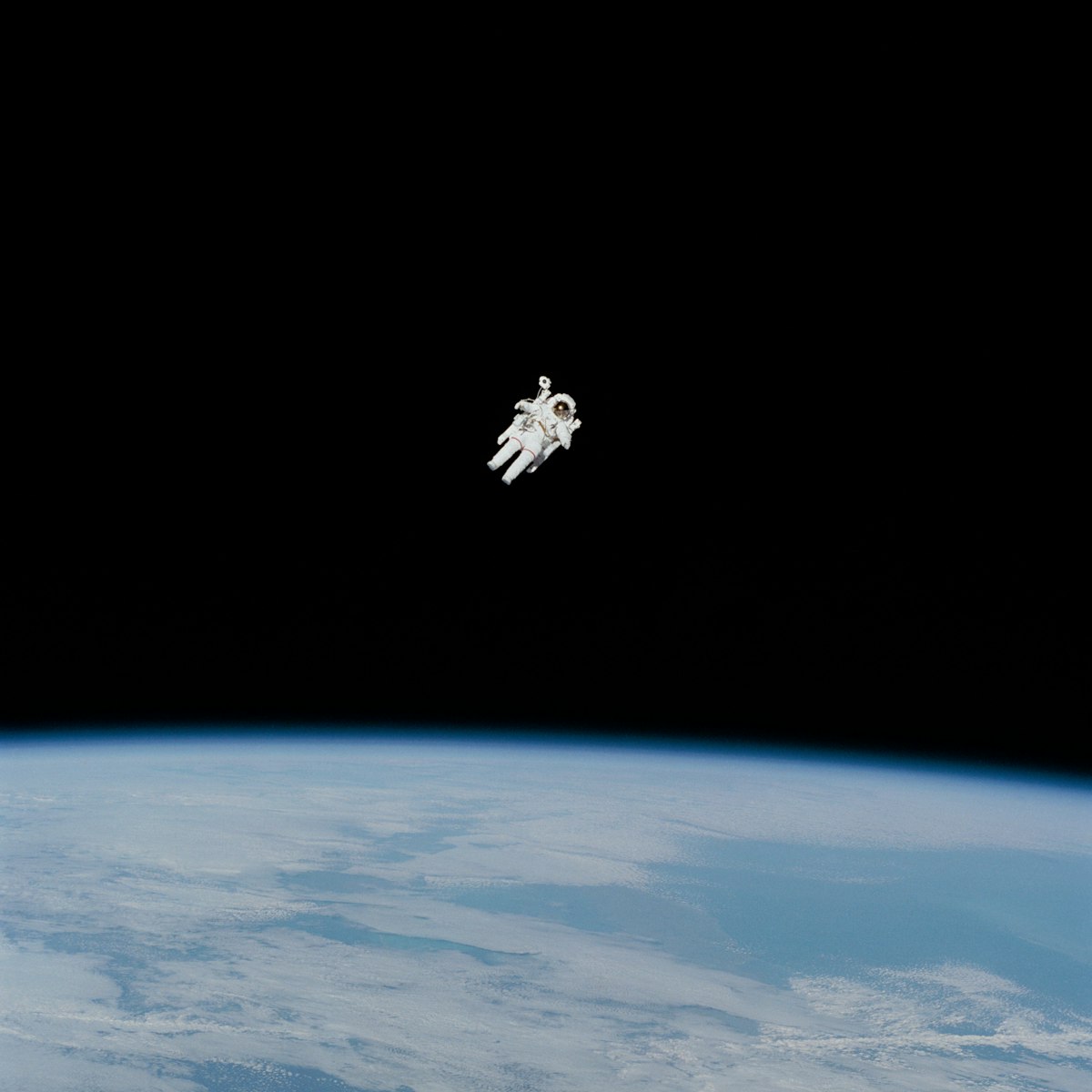 GNSS satellite signal and drone GPS jamming - astronaut over Earth horizon